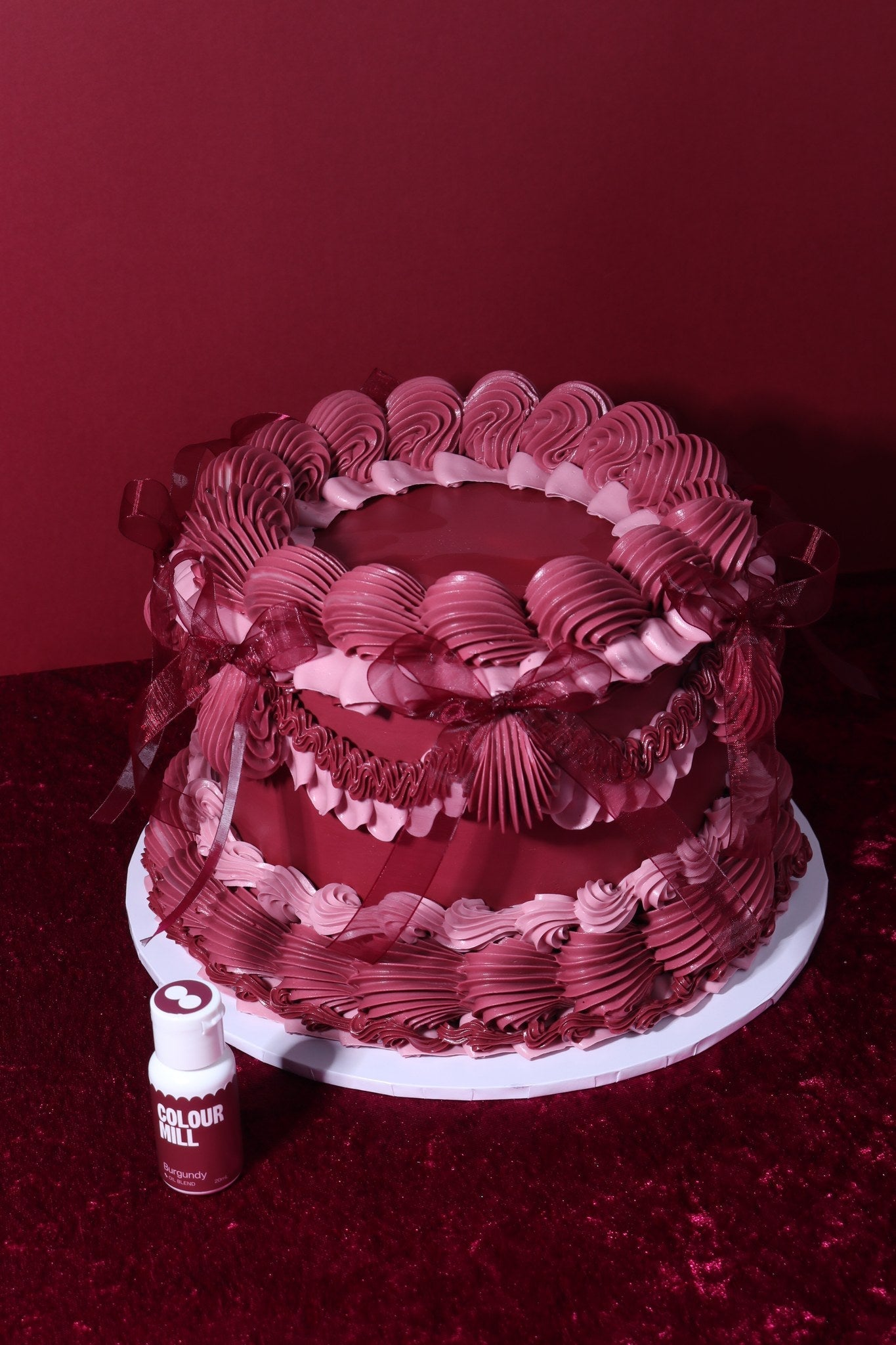 Cake decorated with buttercream colored using Colour Mill Burgundy oil based food coloring