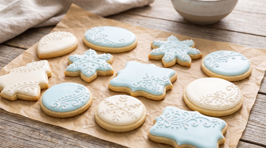 Sugar cookies decorated with smooth flooded royal icing in soft blue and white