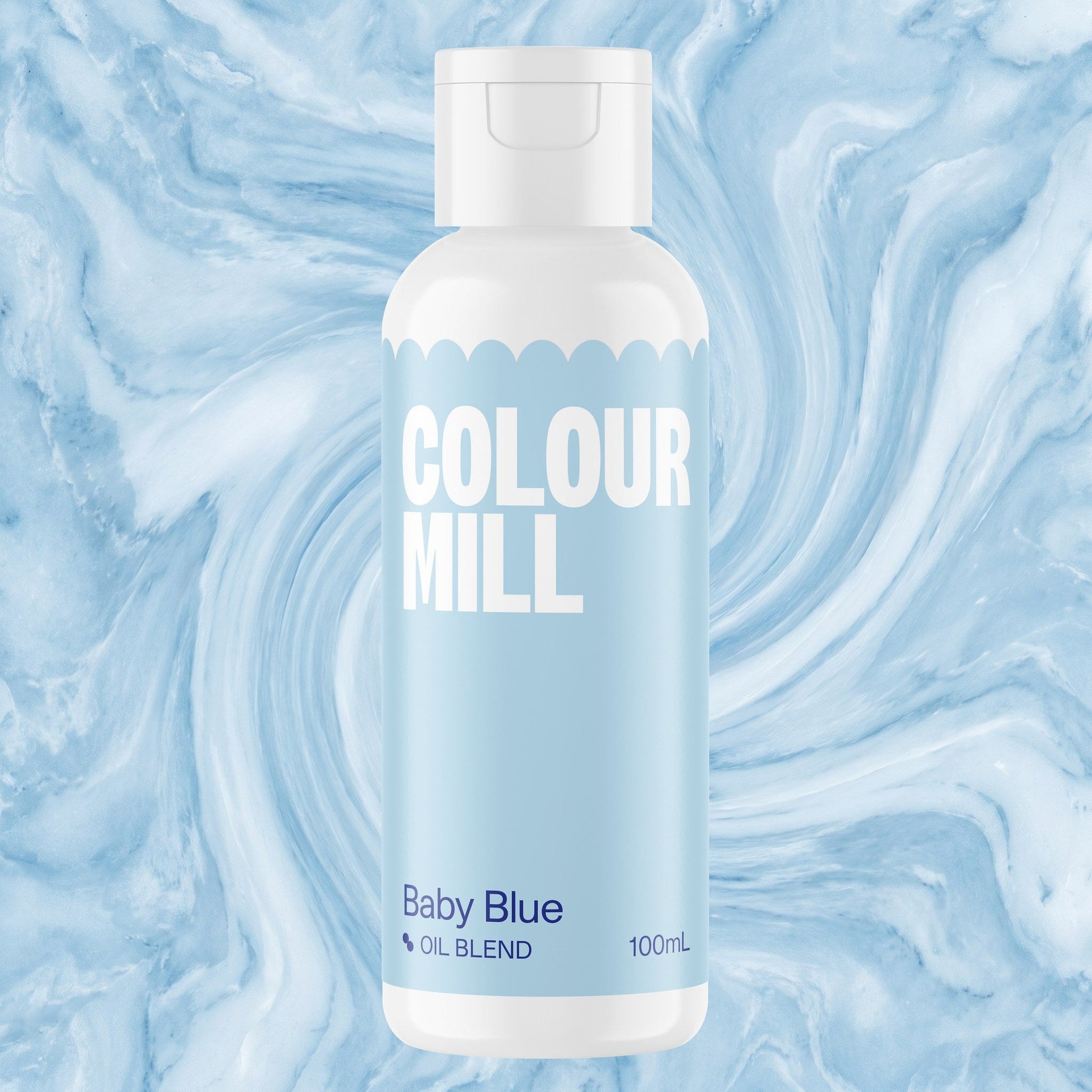 Colour Mill Baby Blue 100ml oil based food coloring bottle on a marbled background