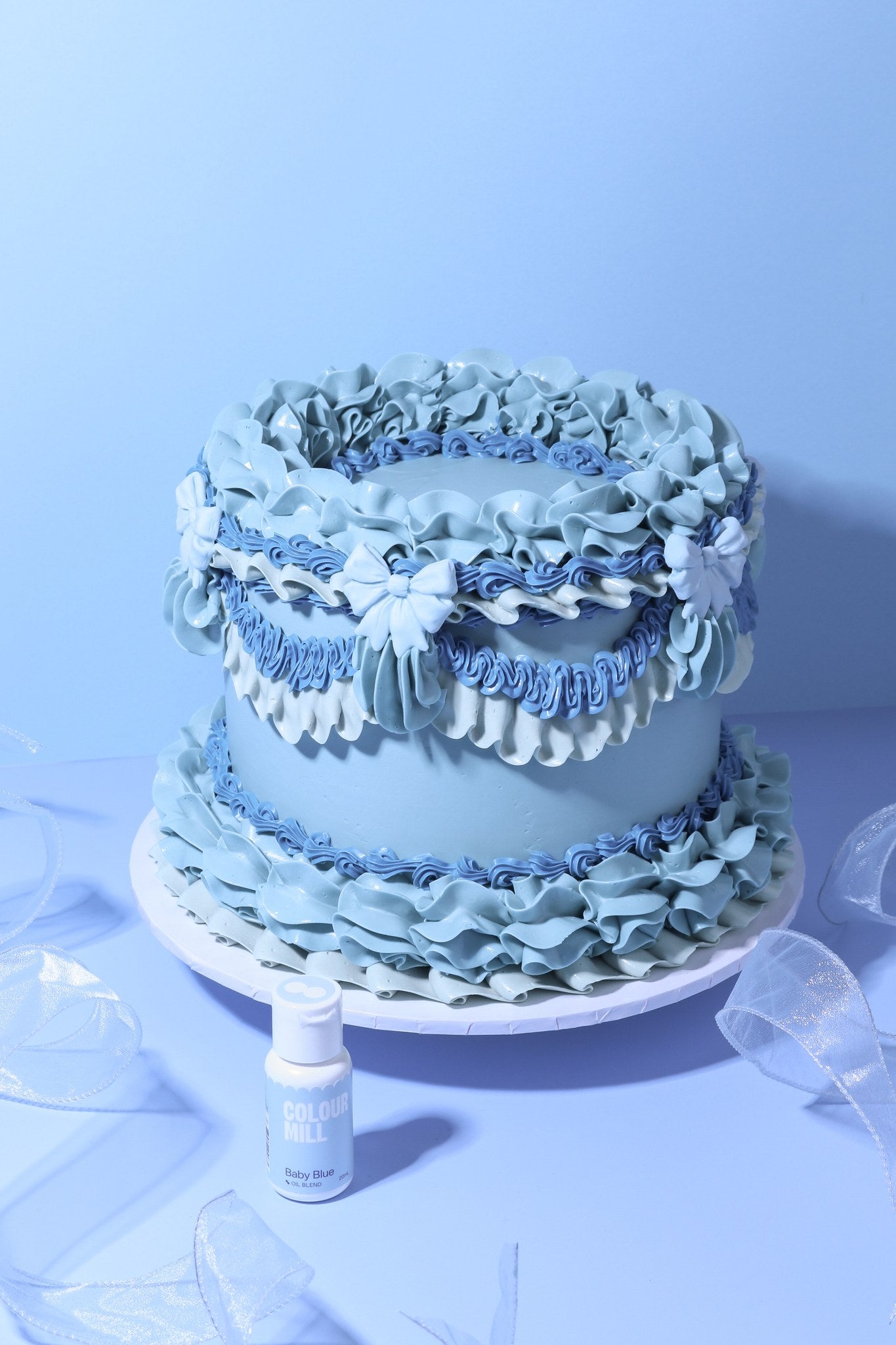 Cake decorated with buttercream colored using Colour Mill Baby Blue oil based food coloring