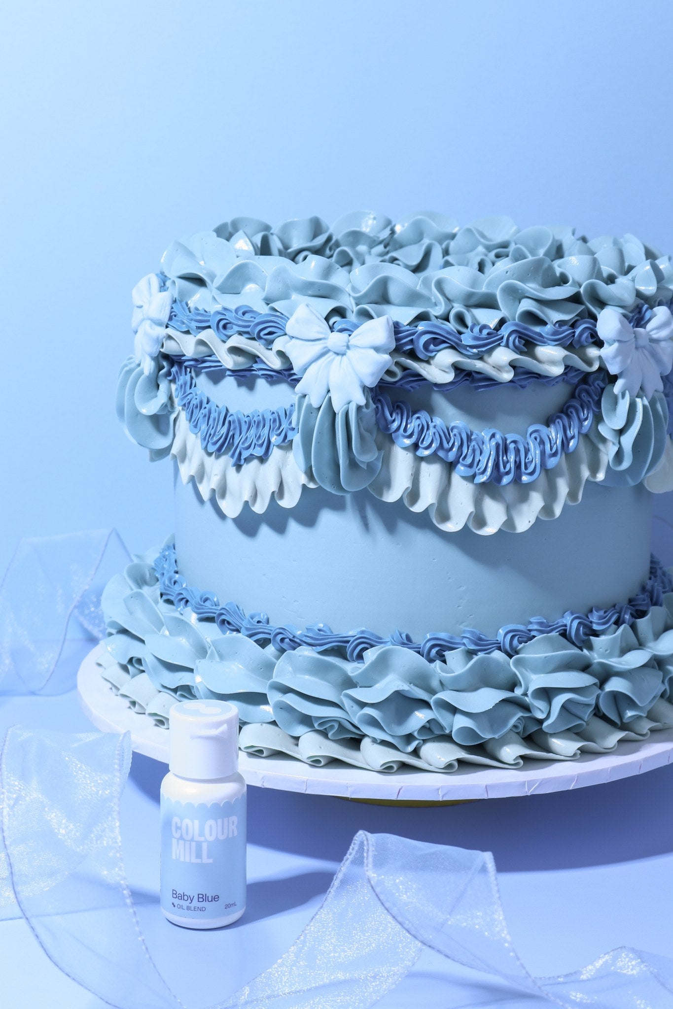 Cake decorated with buttercream colored using Colour Mill Baby Blue oil based food coloring