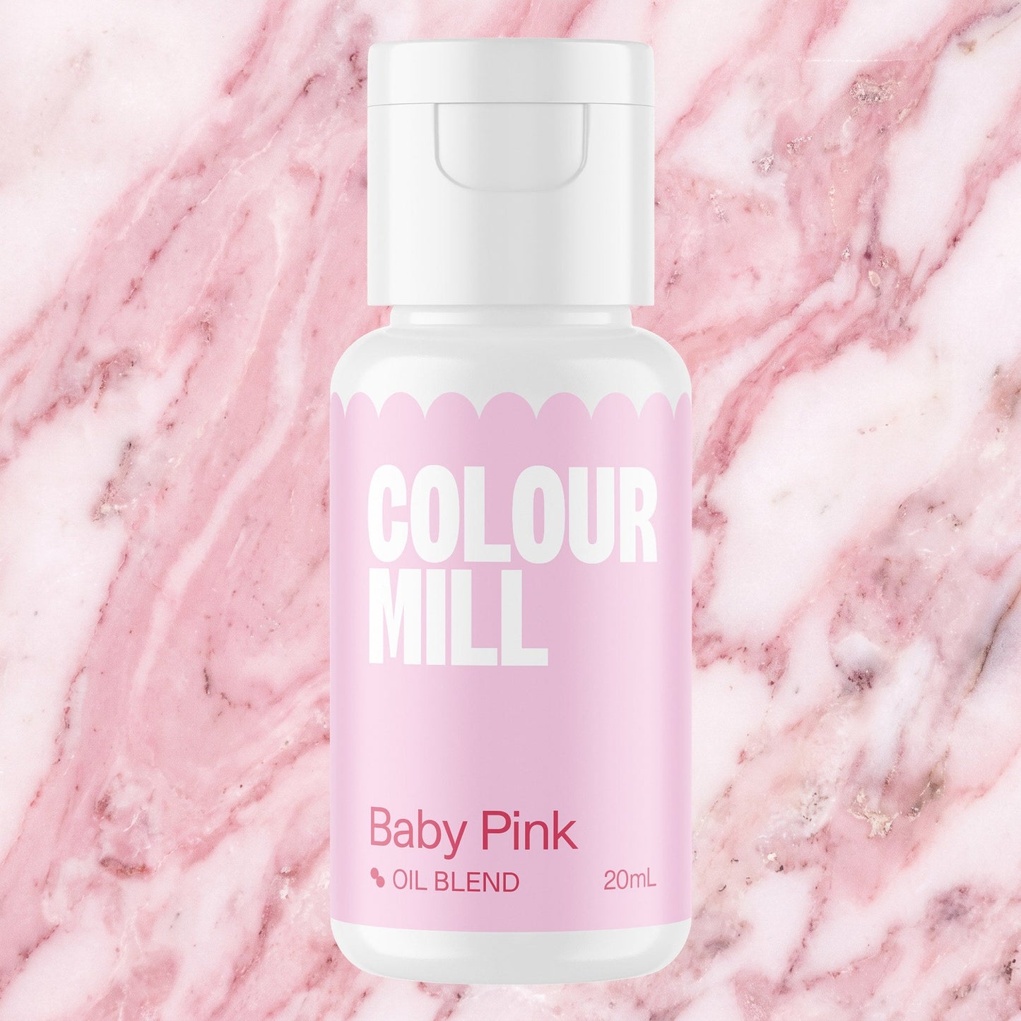Colour Mill Baby Pink 20ml oil based food coloring bottle on a marbled background