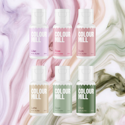 Colour Mill Botanicals Pack of 6 20ml oil based food coloring bottles on a soft botanicals watercolour marble background