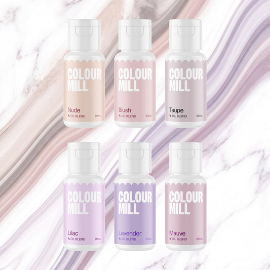 Colour Mill Bridal Pack of 6 20ml oil based food coloring bottles on a soft bridal watercolour marble background
