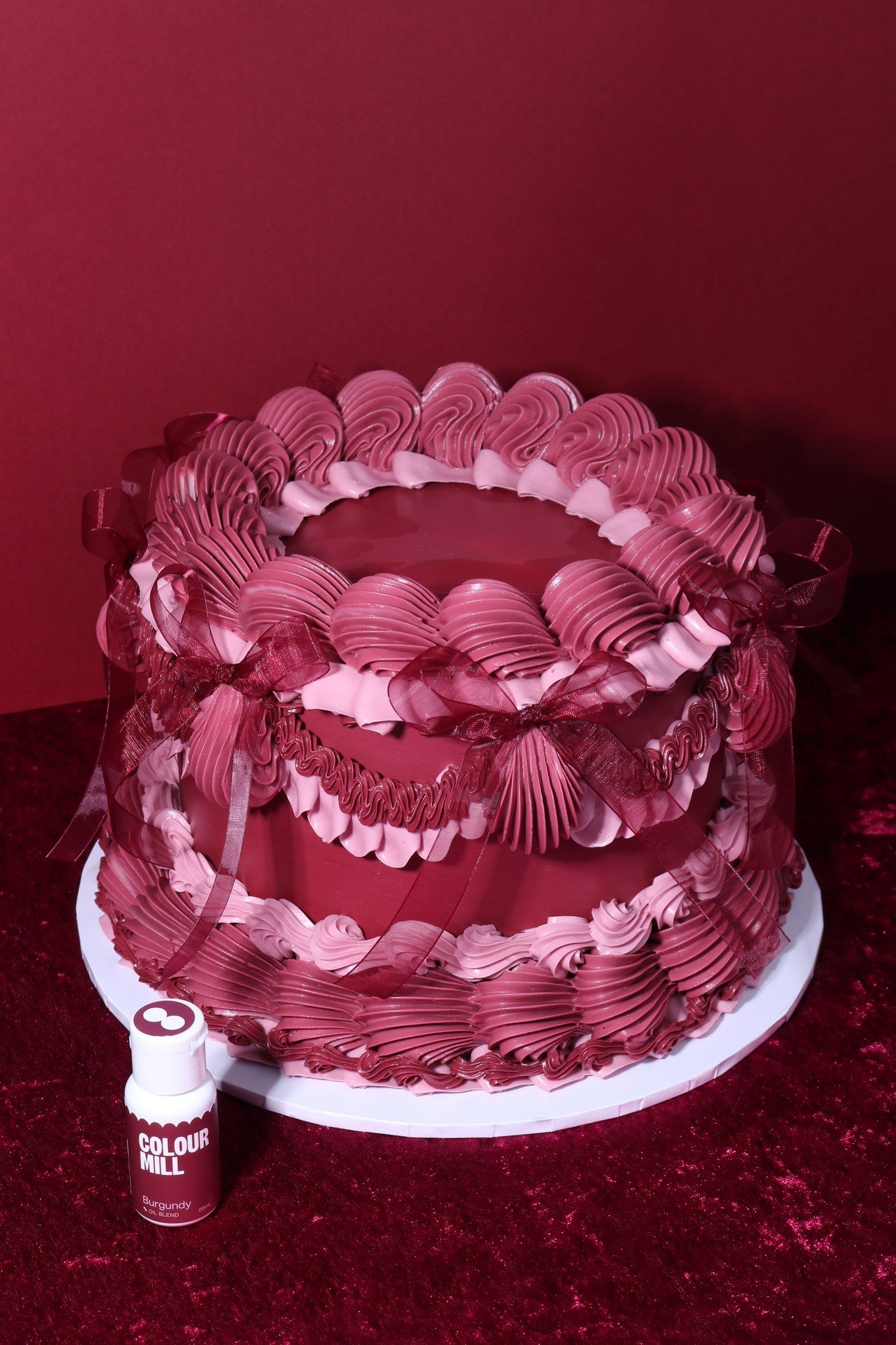 Cake decorated with buttercream colored using Colour Mill Burgundy oil based food coloring