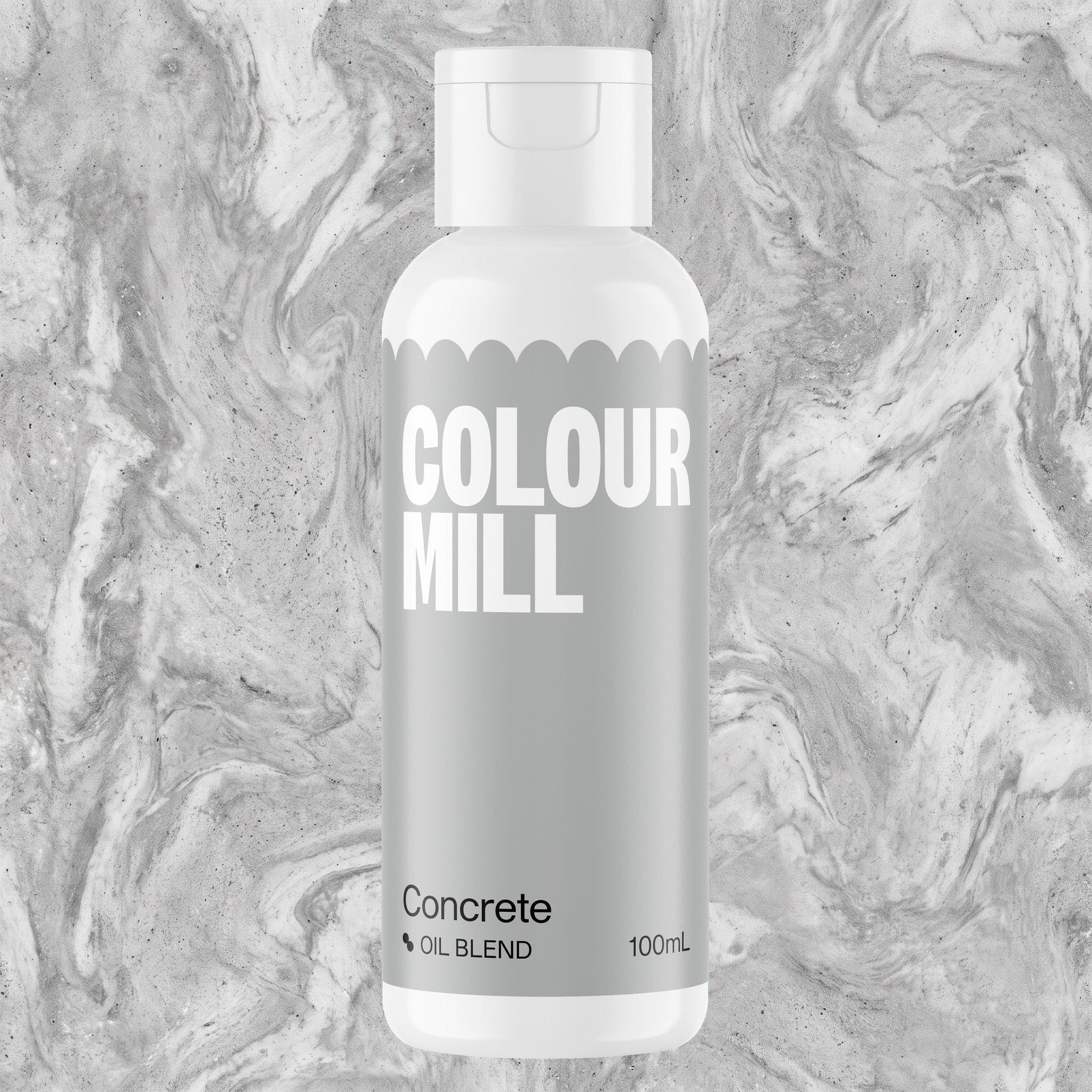 Colour Mill Concrete 100ml oil based food coloring bottle on a marbled background