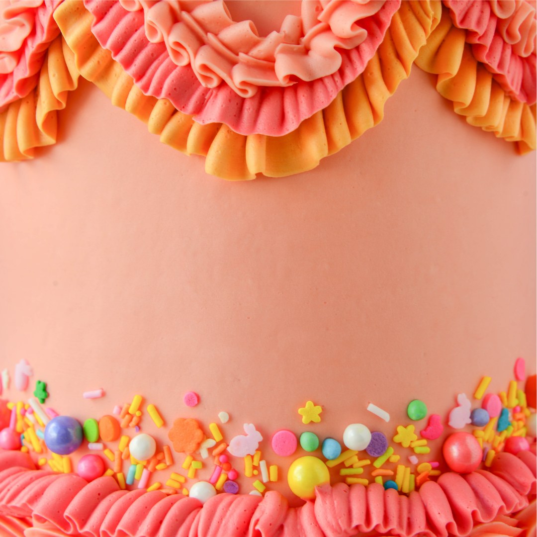 Cake decorated with buttercream colored using Colour Mill Coral oil based food coloring