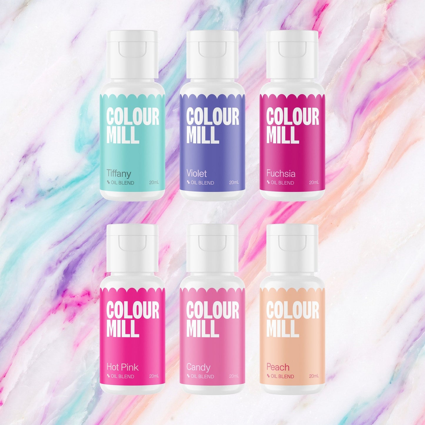 Colour Mill Fairytale Pack of 6 20ml oil based food coloring bottles on a soft fairytale watercolour marble background