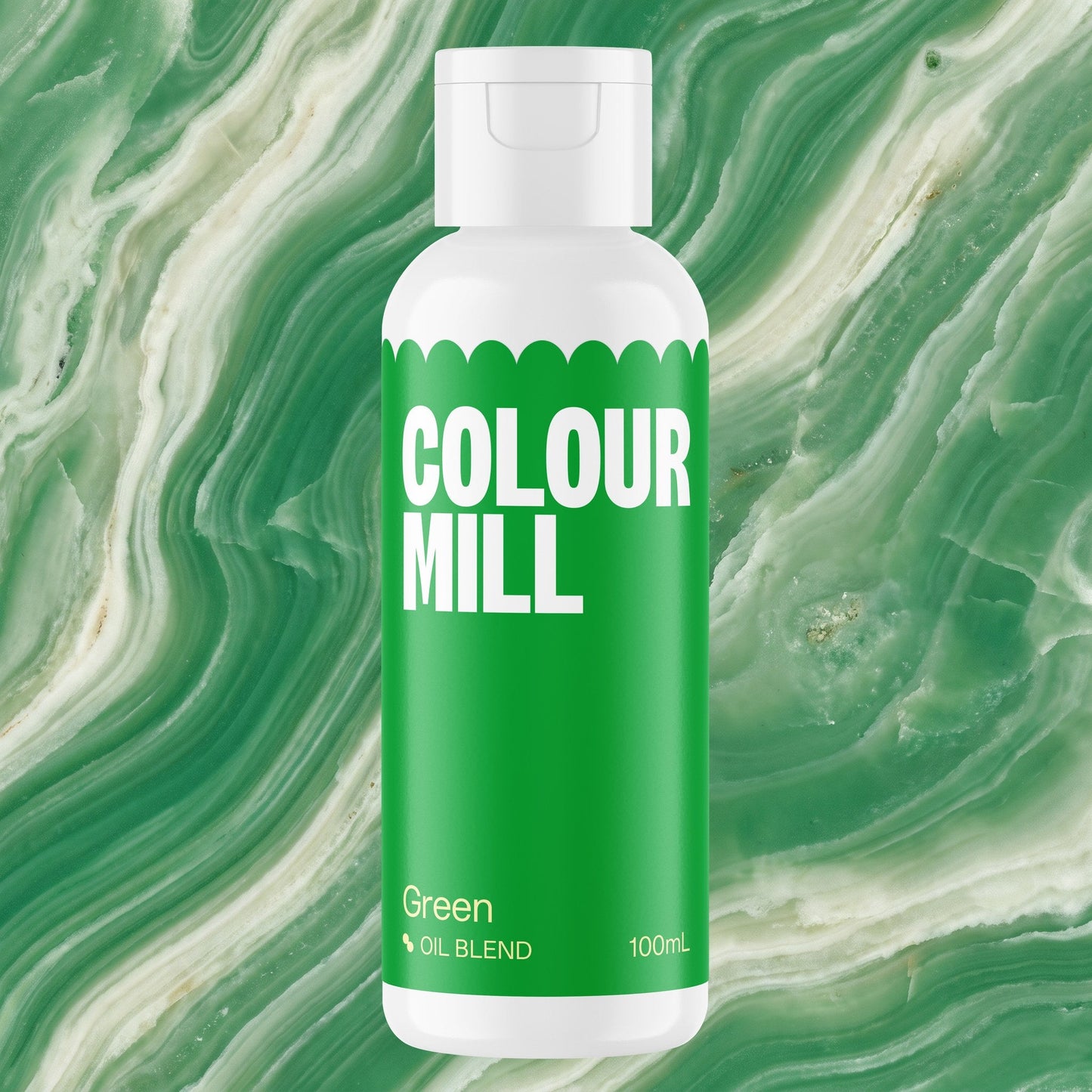Colour Mill Green 100ml oil based food coloring bottle on a marbled background