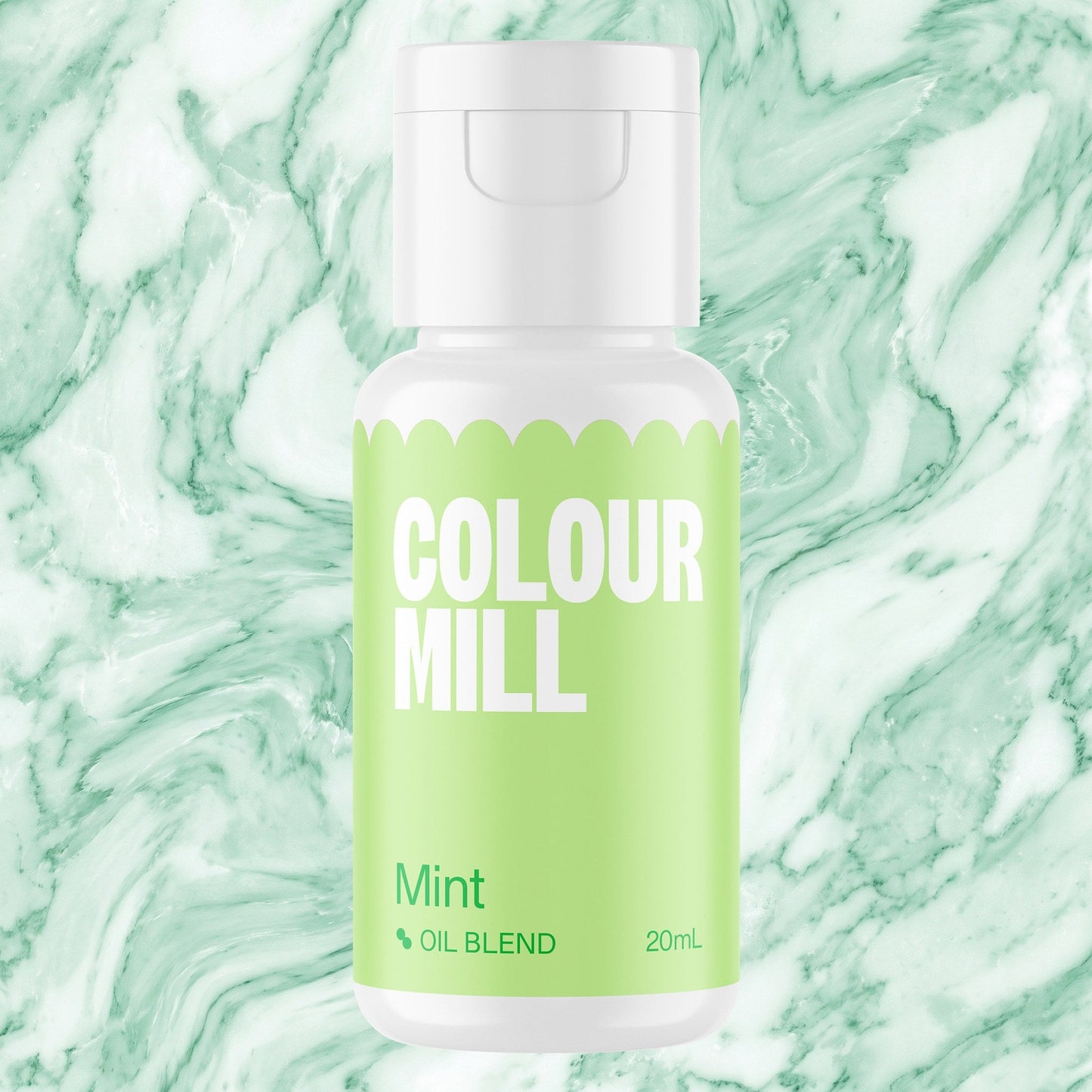 Colour Mill Mint 20ml oil based food coloring bottle on a marbled background