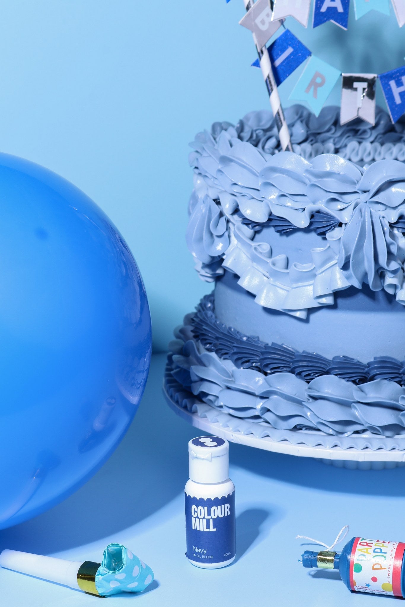 Cake decorated with buttercream colored using Colour Mill Navy oil based food coloring