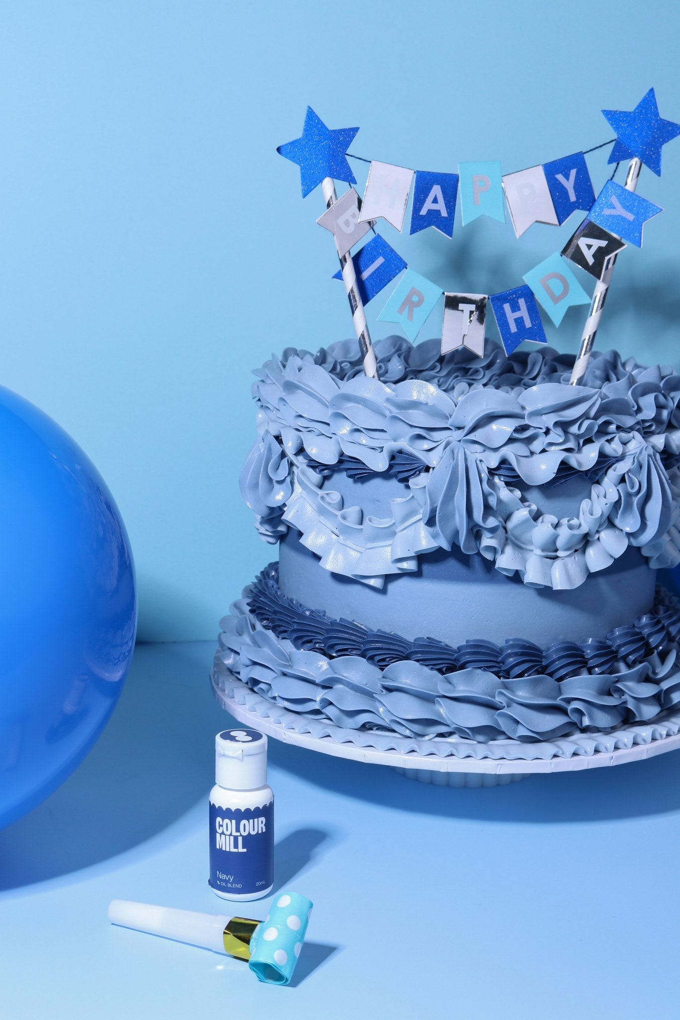 Cake decorated with buttercream colored using Colour Mill Navy oil based food coloring