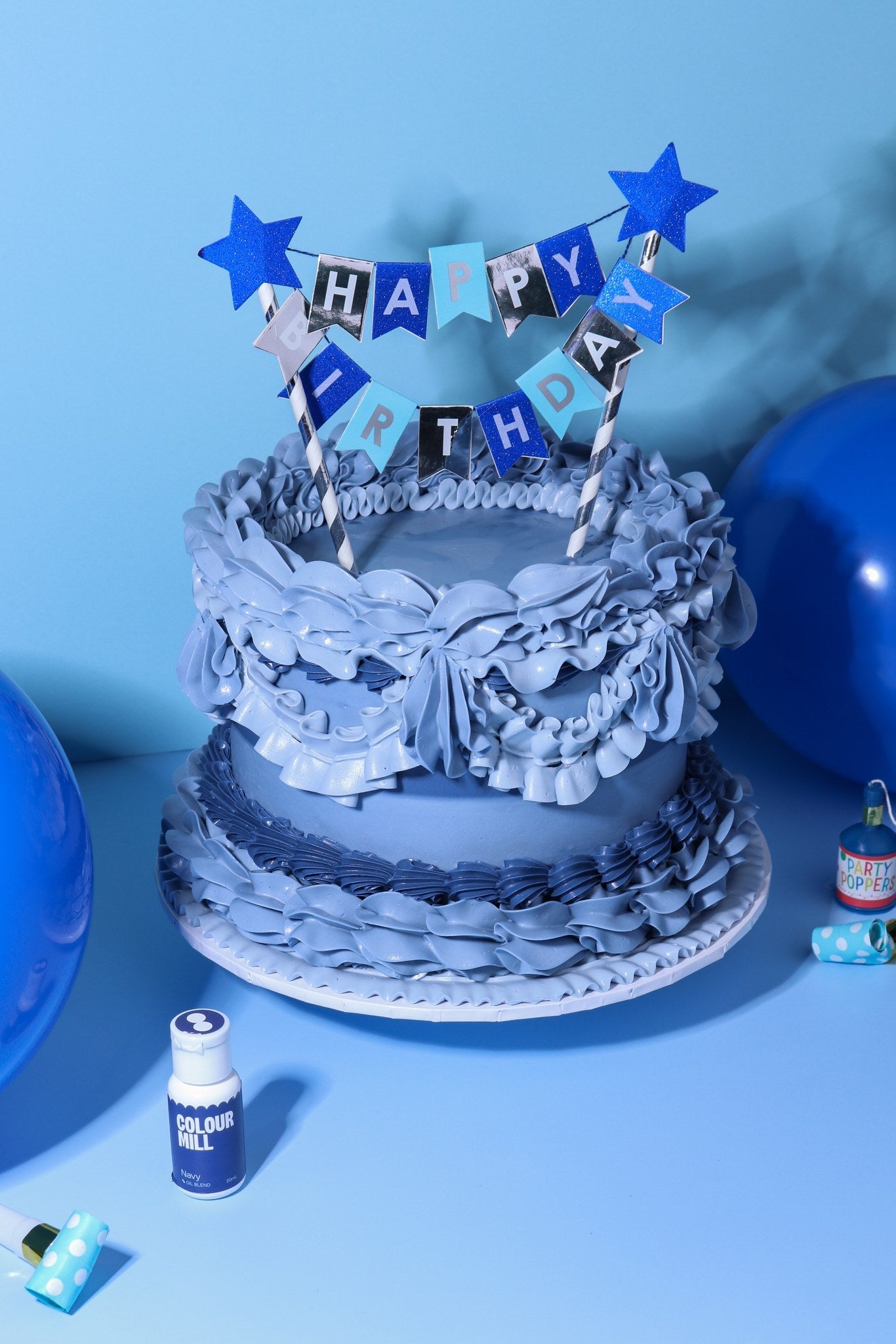 Cake decorated with buttercream colored using Colour Mill Navy oil based food coloring
