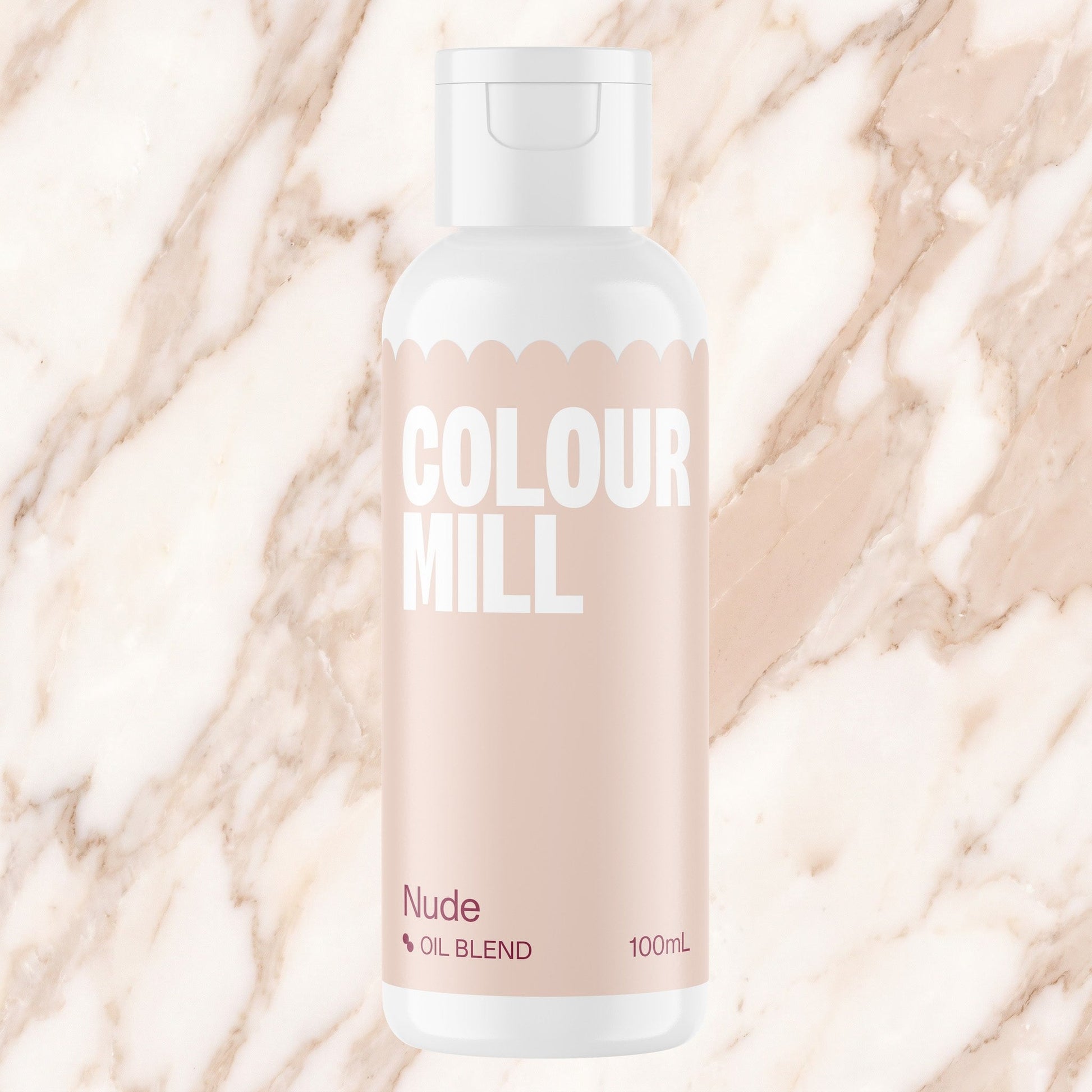 Colour Mill Nude 100ml oil based food coloring bottle on a marbled background