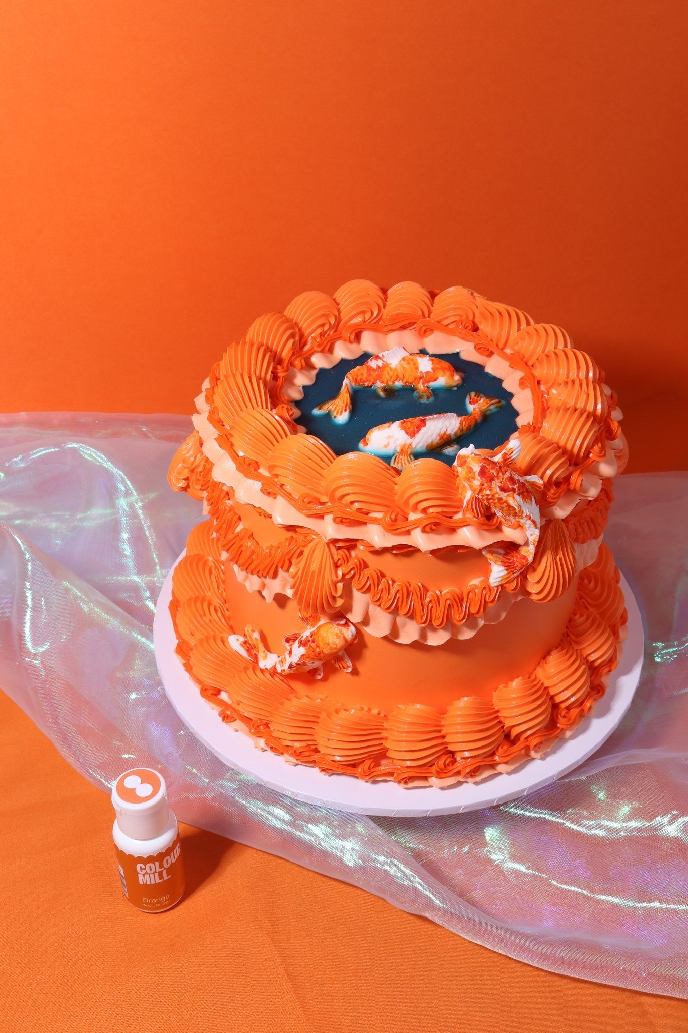 Cake decorated with buttercream colored using Colour Mill Orange oil based food coloring