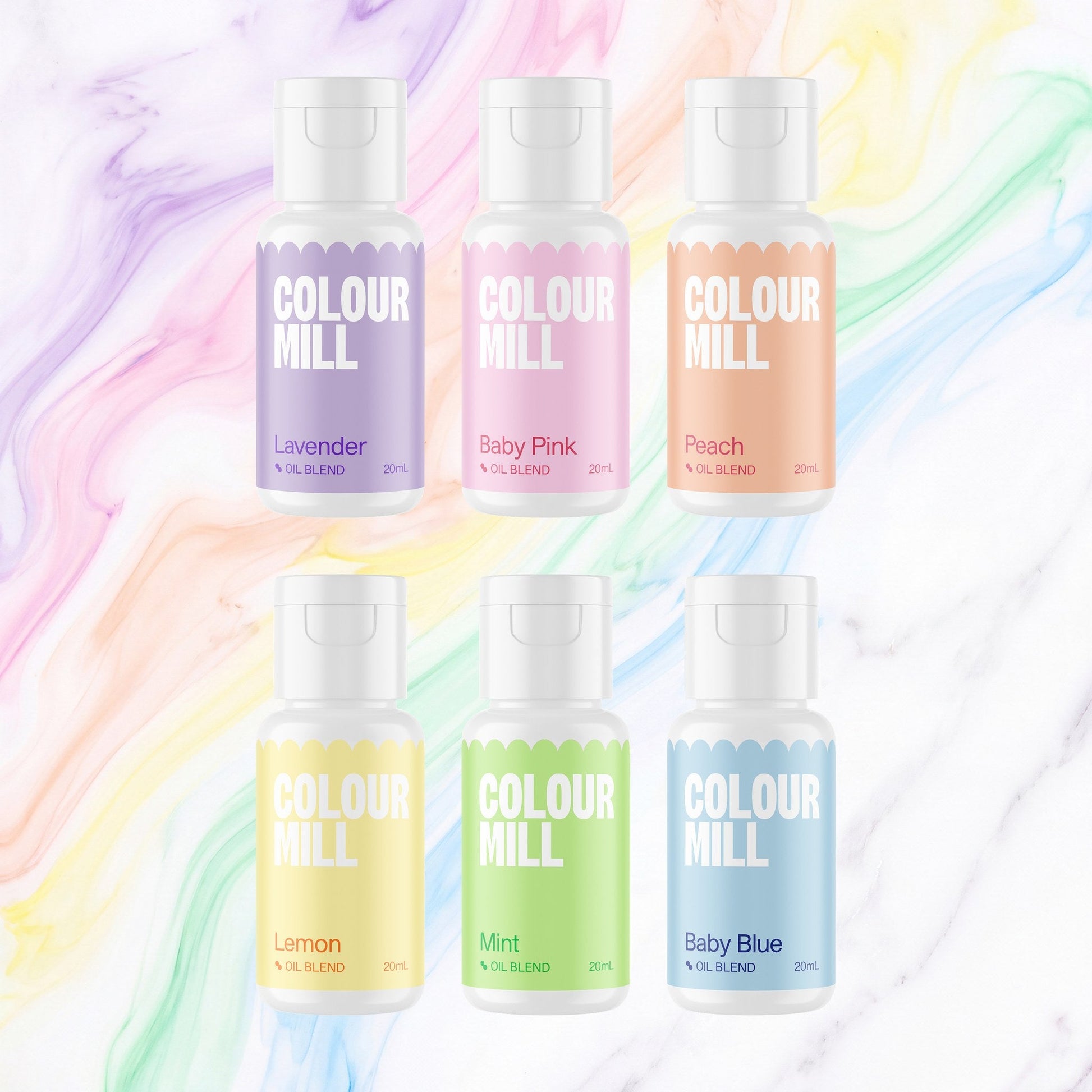 Colour Mill Pastel Pack of 6 20ml oil based food coloring bottles on a soft pastel watercolour marble background