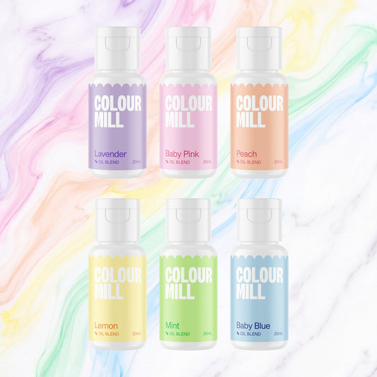 Colour Mill Pastel Pack of 6 20ml oil based food coloring bottles on a soft pastel watercolour marble background