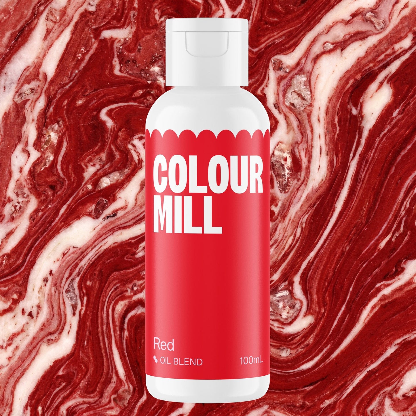 Colour Mill Red 100ml oil based food coloring bottle on a marbled background