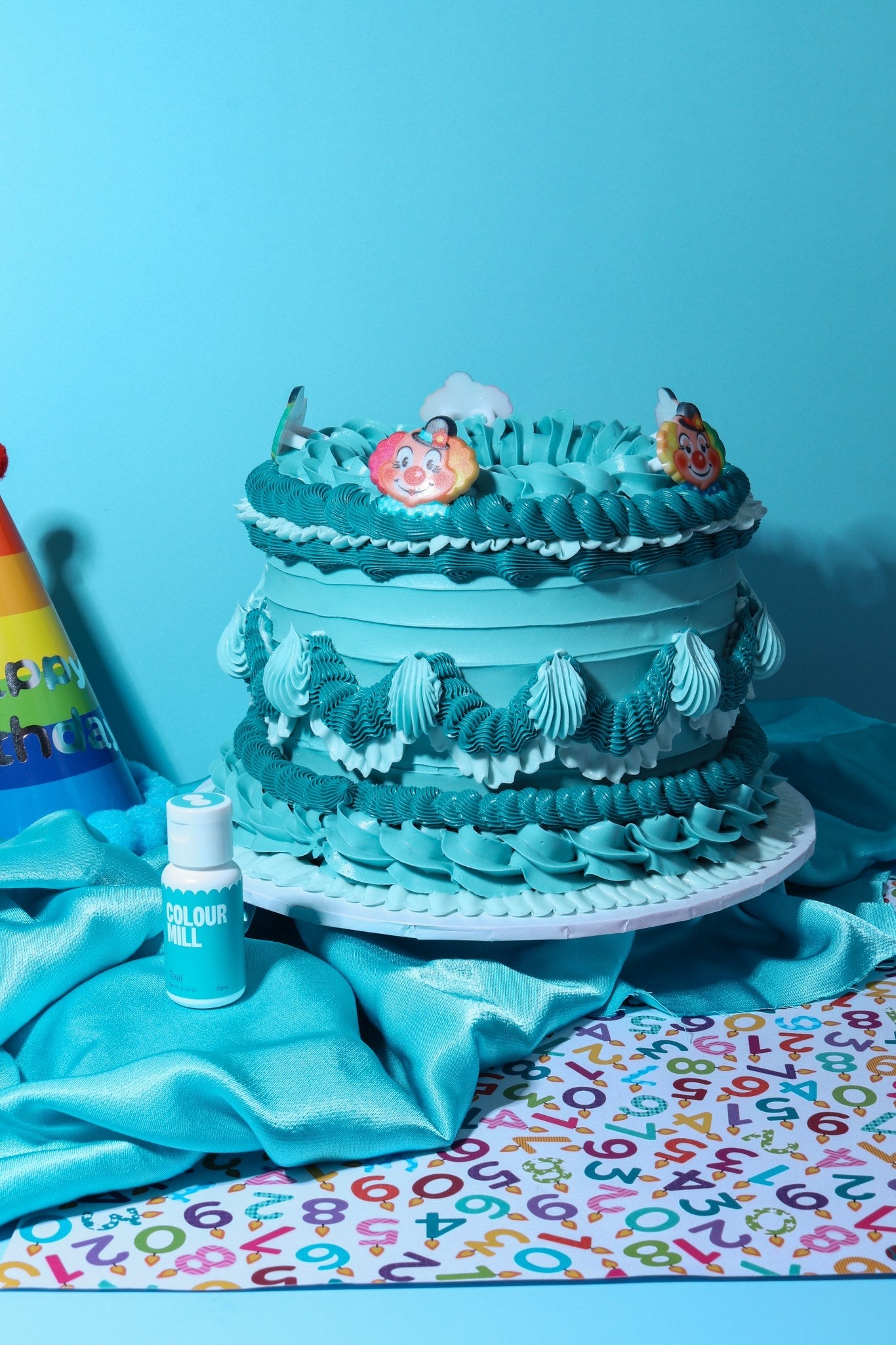 Cake decorated with buttercream colored using Colour Mill Teal oil based food coloring