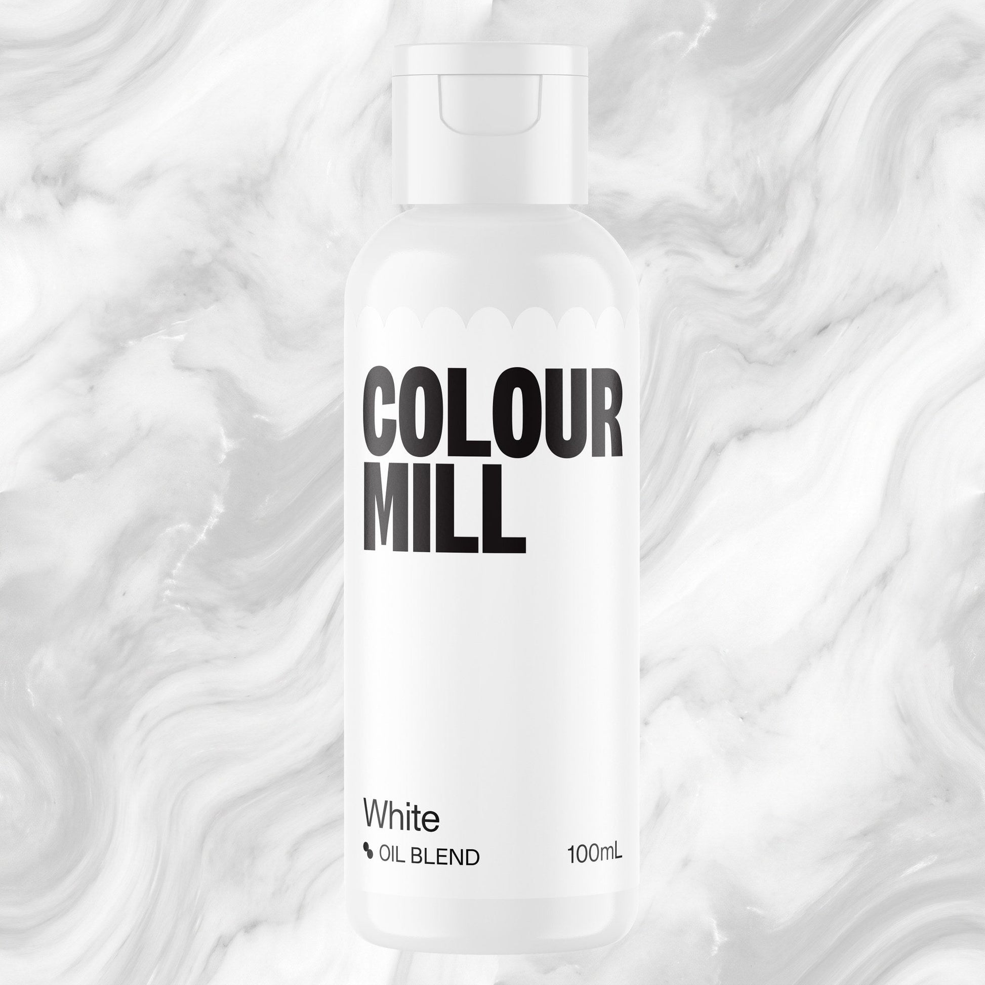 Colour Mill White 100ml oil based food coloring bottle on a marbled background