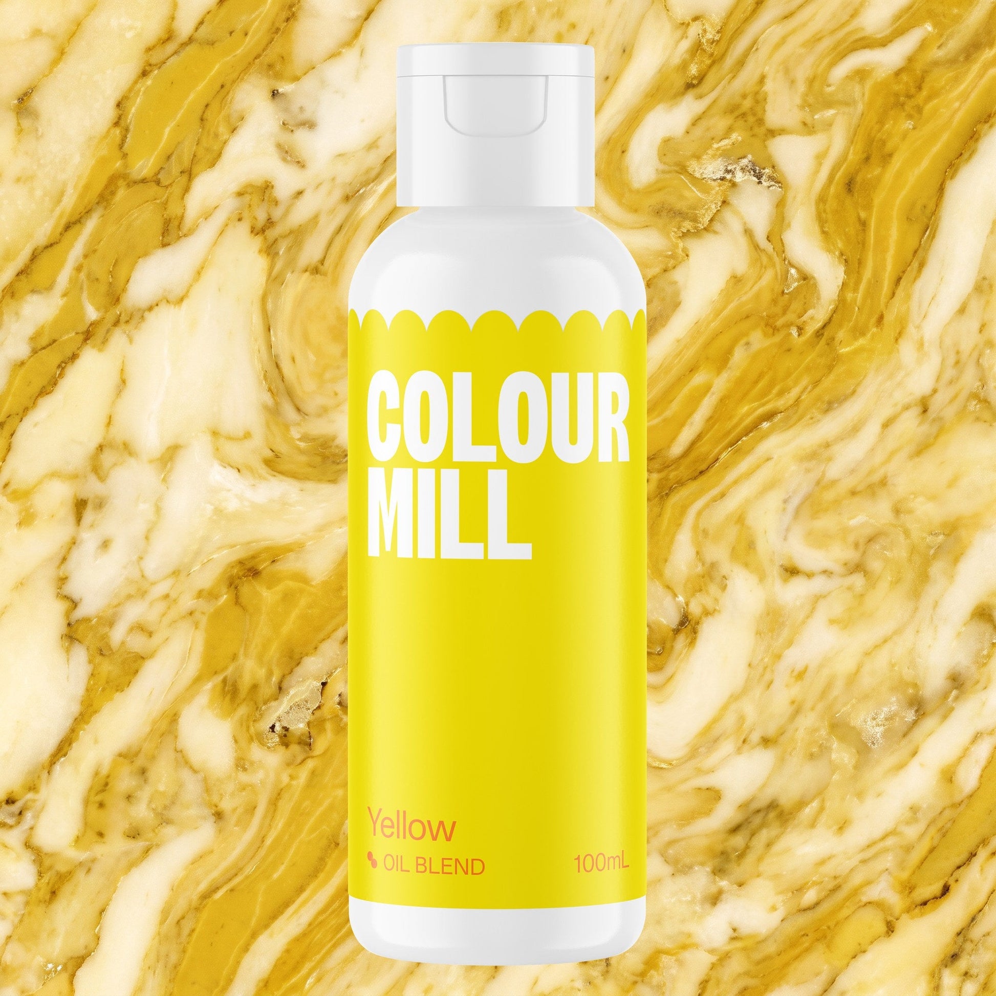 Colour Mill Yellow 100ml oil based food coloring bottle on a marbled background